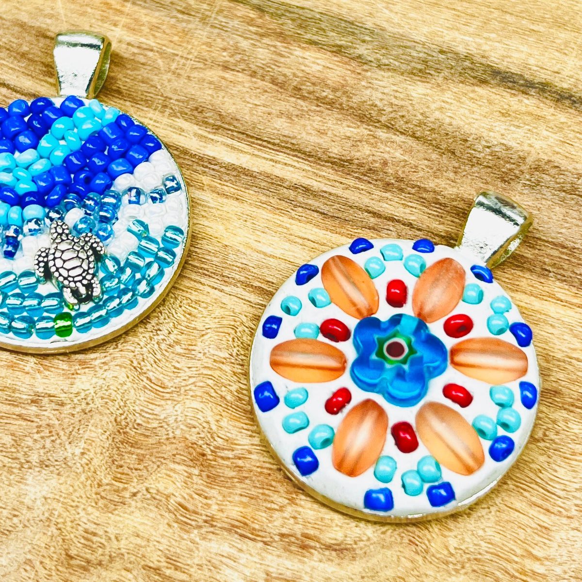 Handmade mosaic pendants created with colorful glass and beads